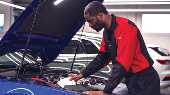 Technician working on car