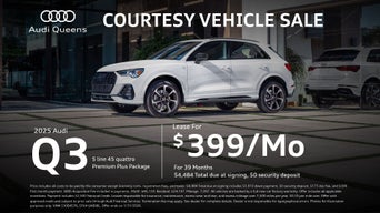 Left side profile of an Audi Q3 parked.