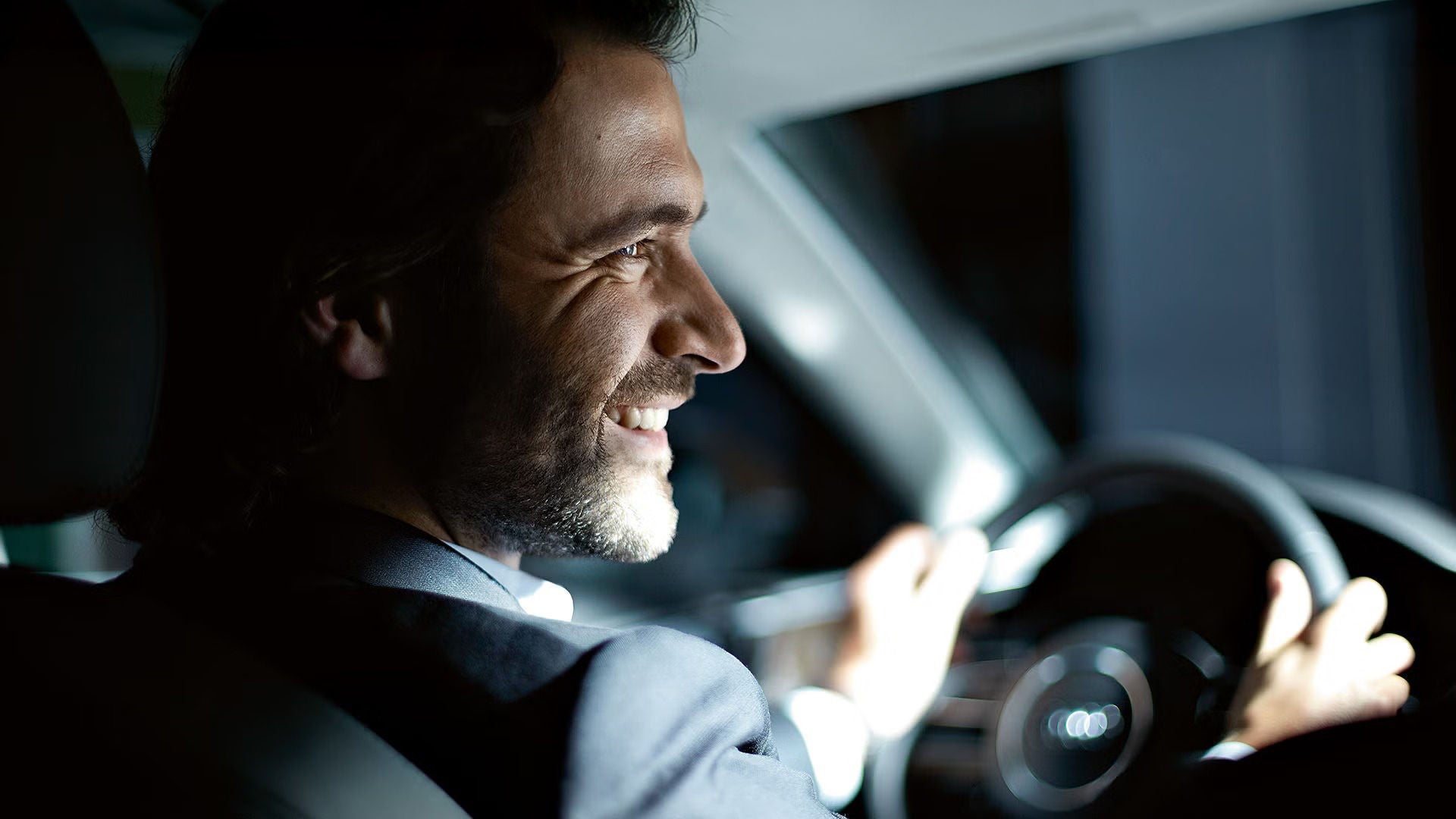 Image of a business man sitting in an Audi