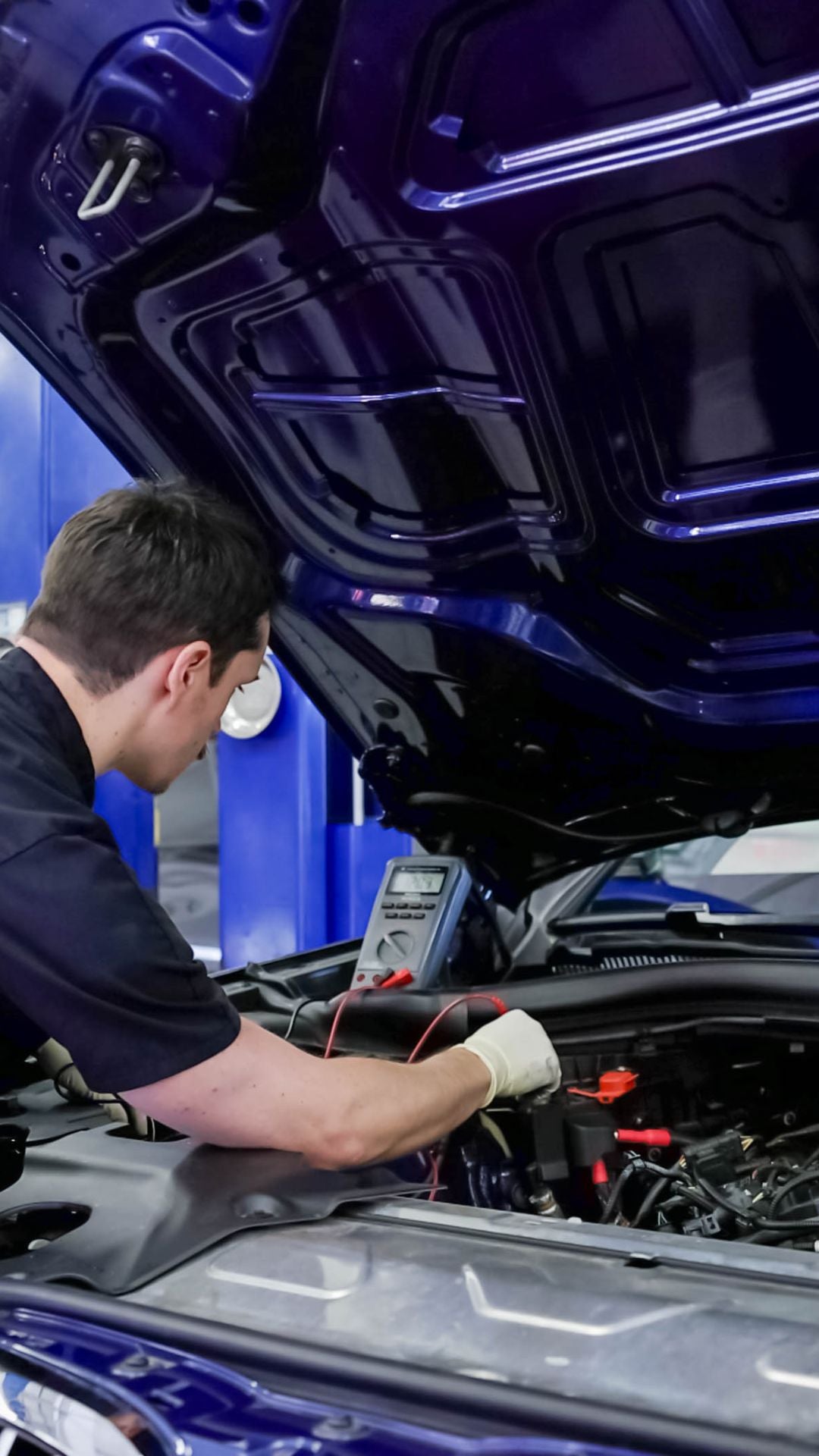 Front profile view of an Audi Q5 vehicle being serviced.