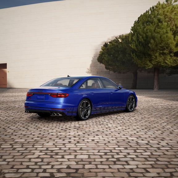 Three-quarter rear view of the Audi S8 parked.