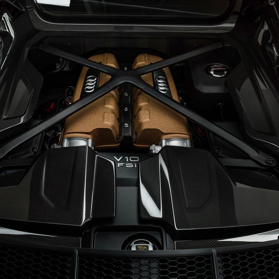 Close-up of the bronze intake manifolds inside the Decennium Edition Audi R8.