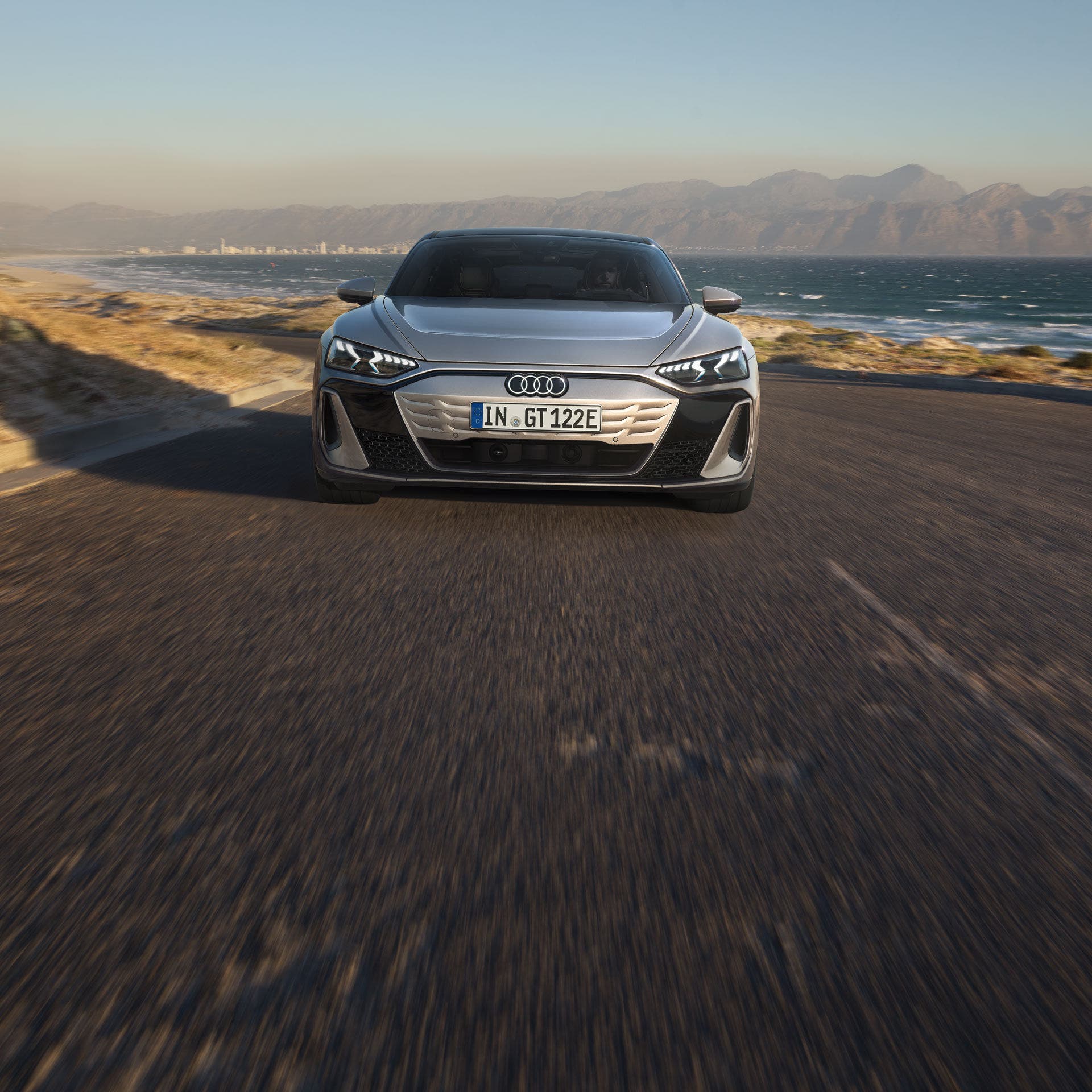 Front view of Audi e-tron GT accelerating. 