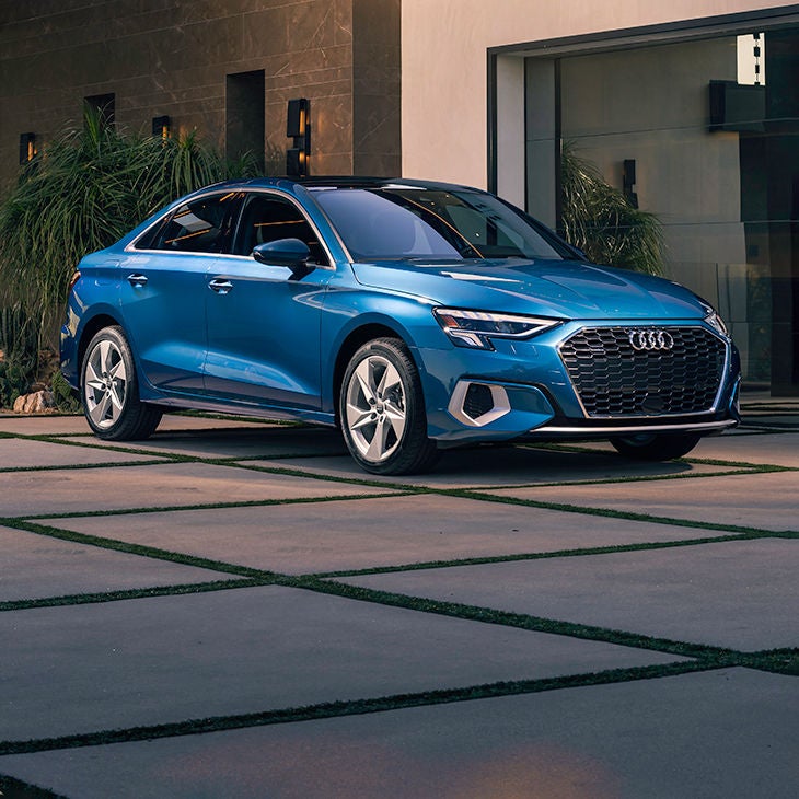 Three-quarter front profile of the Audi A3 Sedan parked.