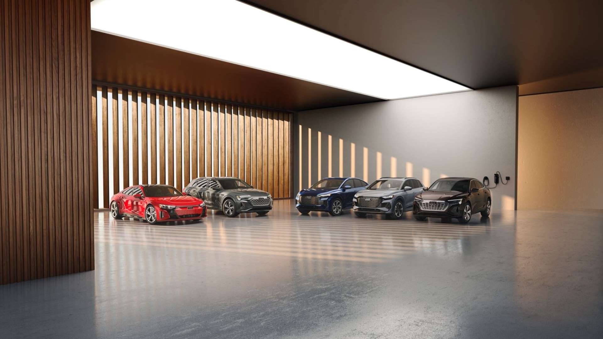 Lineup of Audi electric models in a showroom, parked.