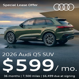 A green Q5 parked.