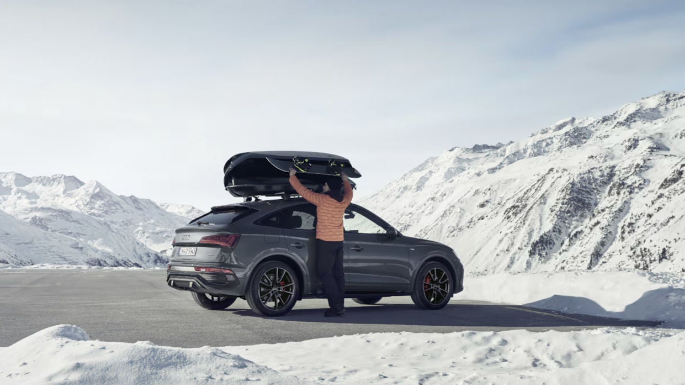 Profile view of Audi vehicle. 