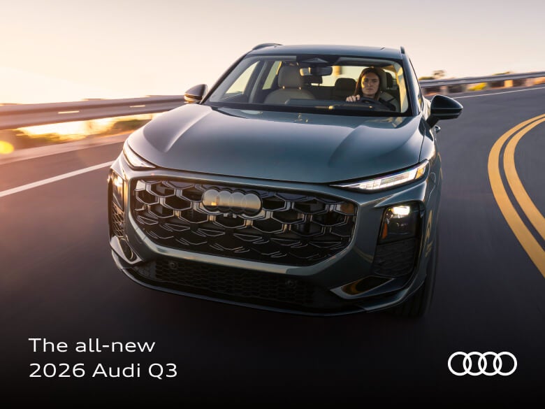 Front and rearview of a 2026 Audi Q3 TFSI® quattro® S tronic® in Sage Green Metallic on a highway