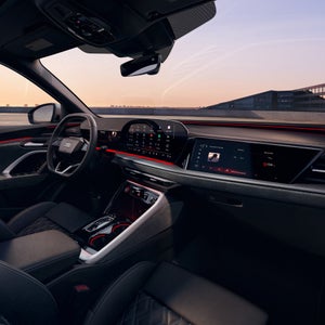 Close-up of the wraparound virtual cockpit and passenger screen in the Audi SQ5 Sportback.