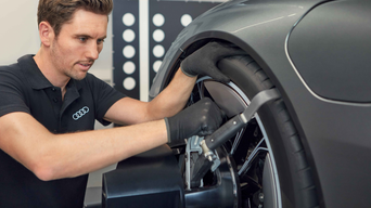 audi worker working on a car 
