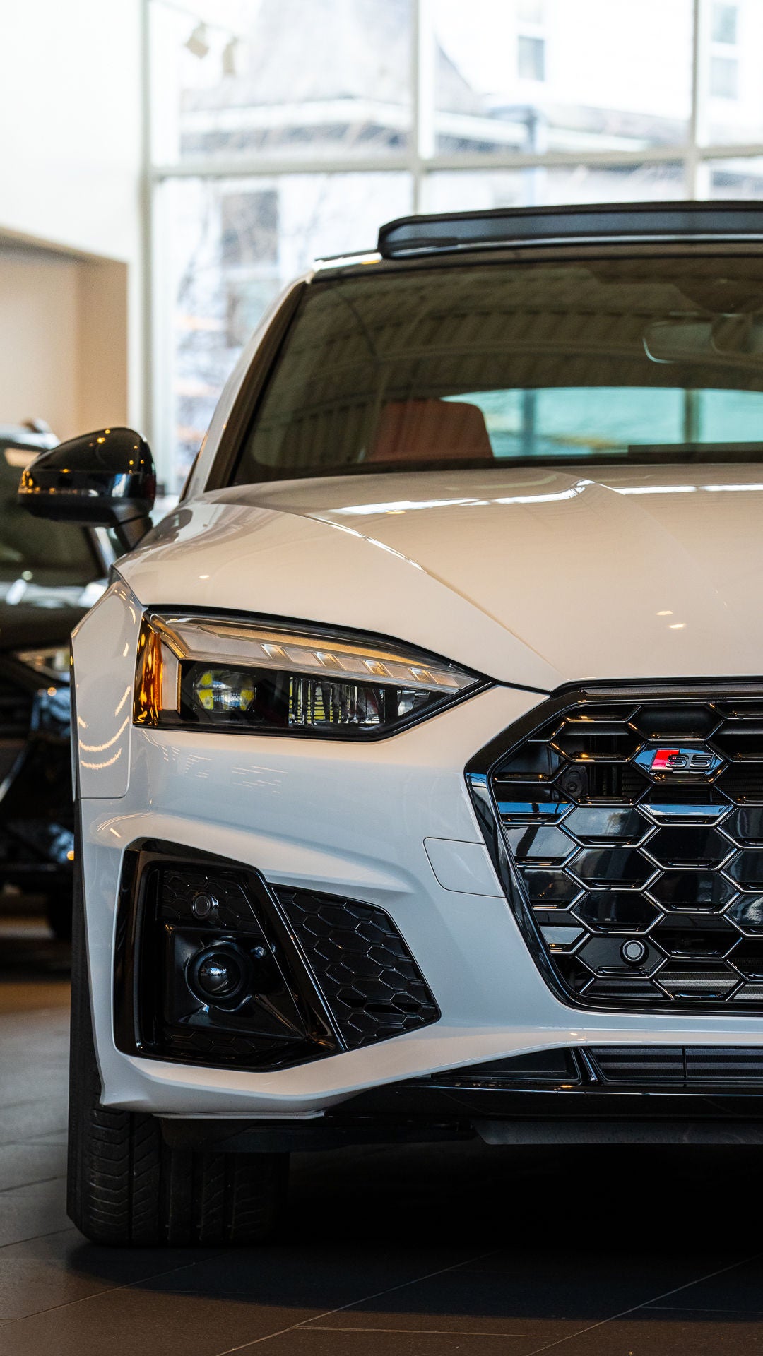 Audi vehicles in showroom.