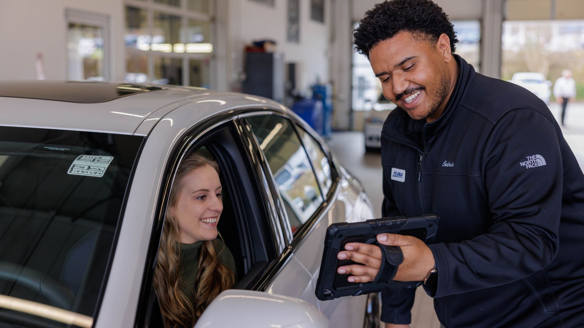 Audi service technician servicing a vehicle.