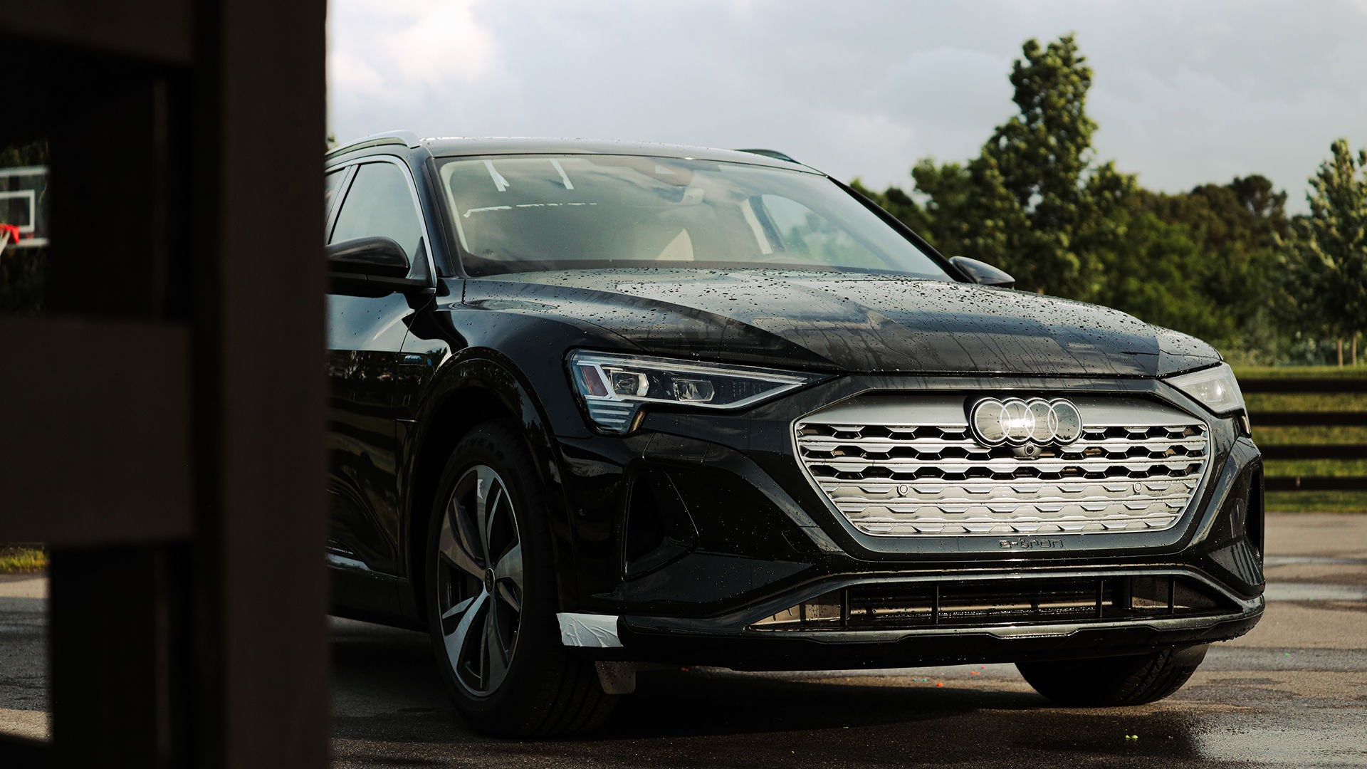 Three quarter view of an Audi q7 vehicle parked.