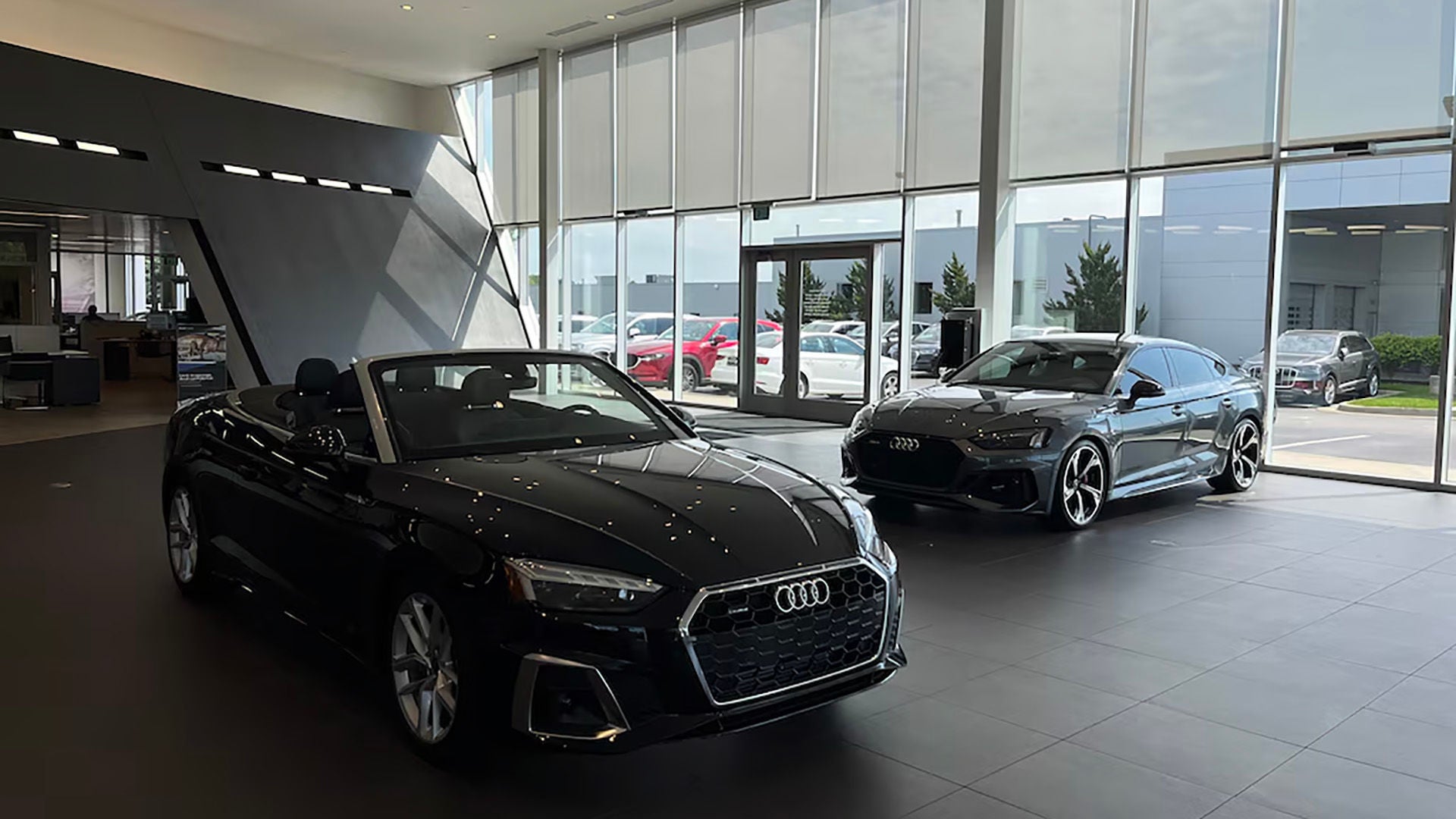 Audi vehicles in showroom.