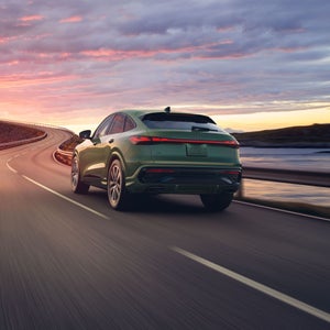 Rear view of and Audi Q5 Sportback on the highway.