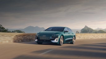 Three-quarter front view of the Audi S6 e-tron in motion.