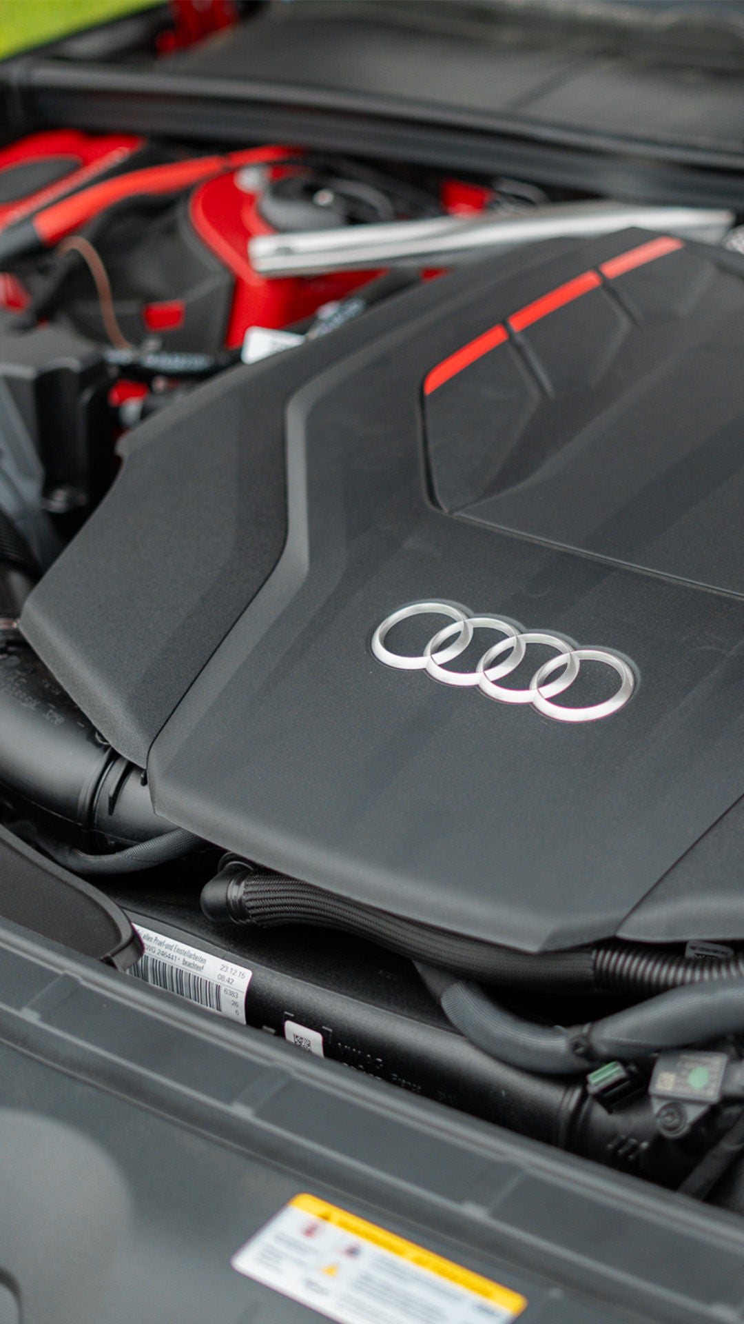 Front profile view of an Audi Q7 accelerating.