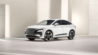 Three-quarter front view of the Audi Q4 Sportback e-tron.