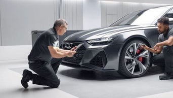 Service technician servicing tire.