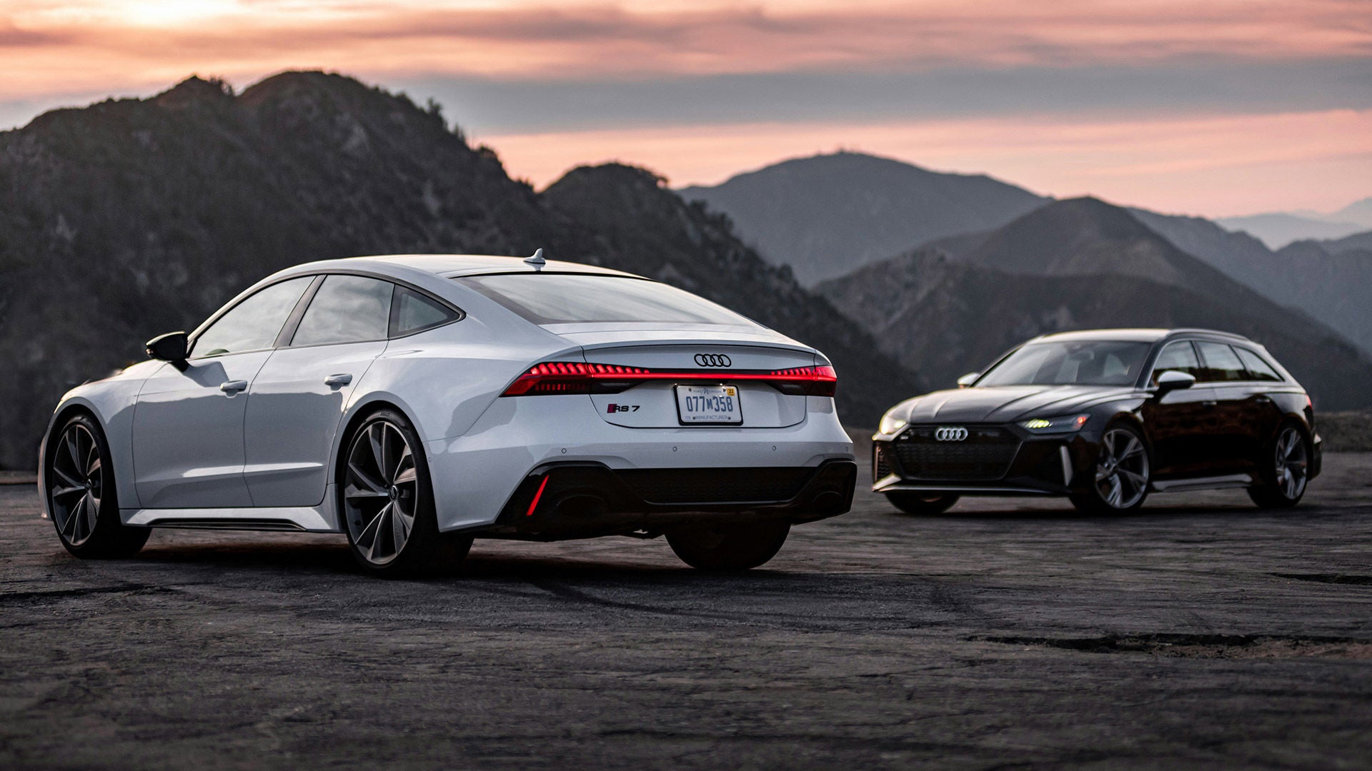 Two Audis Vehicles with Mountains 