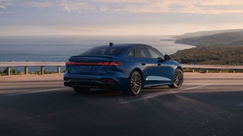 Three-quarter rear view of the Audi S5 parked.
