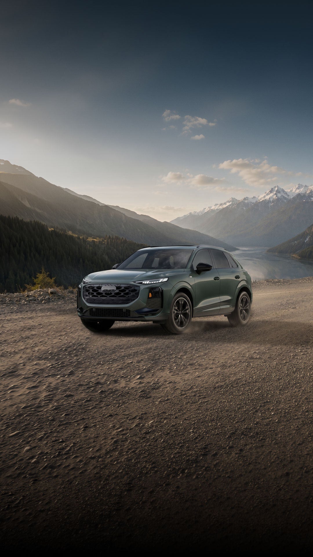 Three-quarter side profile of the Audi Q3 accelerating.