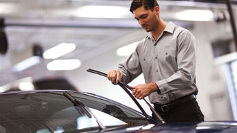 Service technician replacing Audi wiper blades