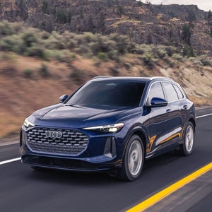 Side view of an Audi Q5 driving.