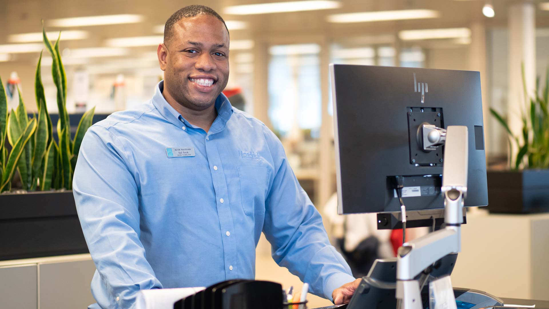 Audi service technician servicing a vehicle.