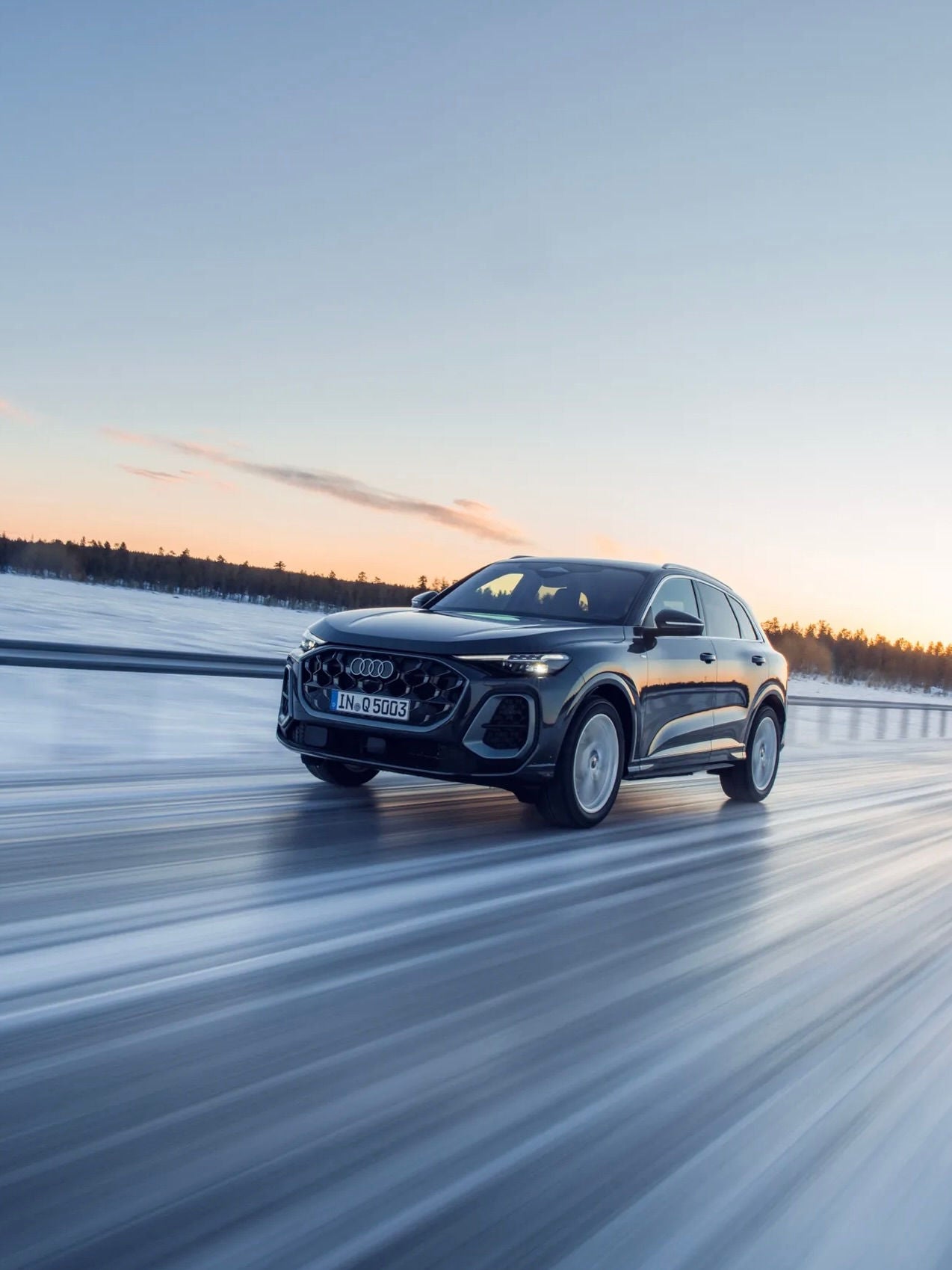 Profile view of Audi vehicle. 