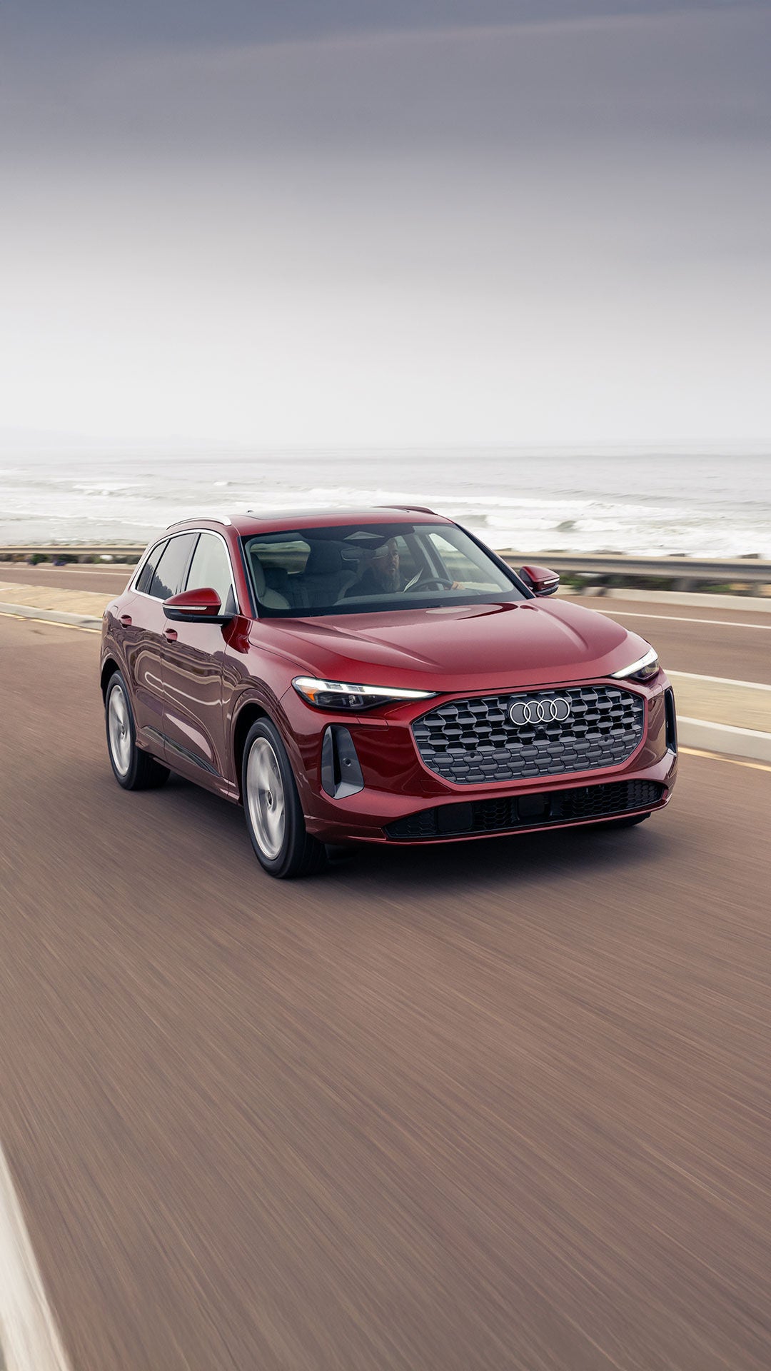 Left side profile view of an Audi S6 parked.