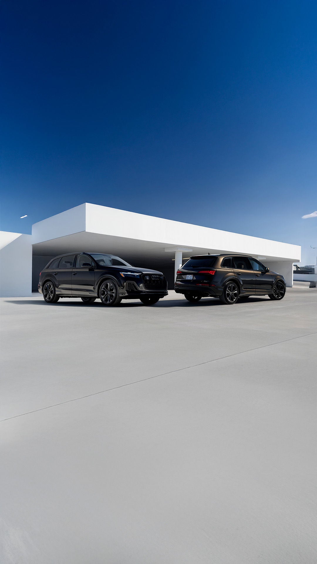 2026 Audi Q7 dimensions shown by two Q7 trims parked side by side in parking lot